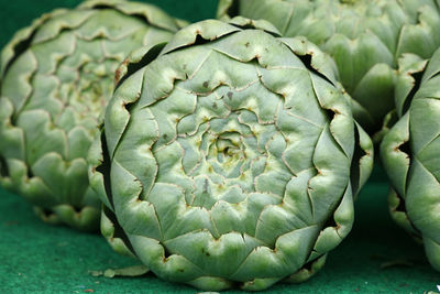 Close-up of artichokes on table