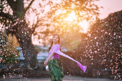 Rear view of a girl smiling in water