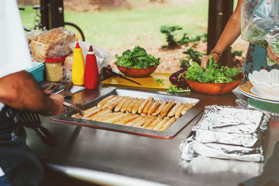 Man preparing food on barbecue grill