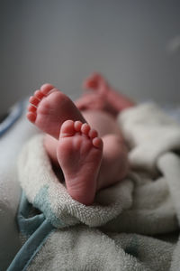 Close-up of baby feet on bed