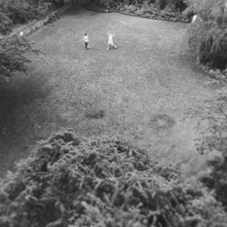 High angle view of men walking on road