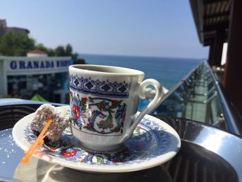 Close-up of coffee cup on table