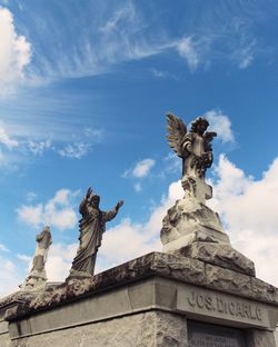 Low angle view of statue against sky