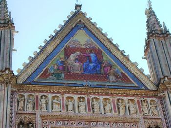 Low angle view of temple against building