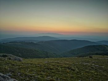 Scenic view of landscape against sky during sunset