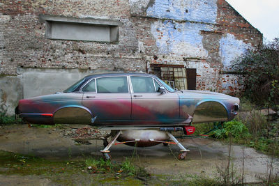 Abandoned car on building