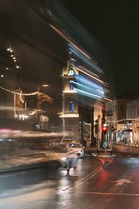 Illuminated city street at night