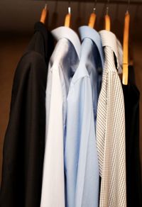 Close-up of shirts hanging in wardrobe