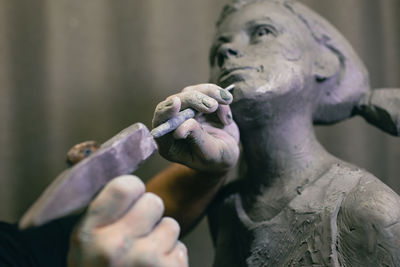 Close-up of man smoking electronic cigarette