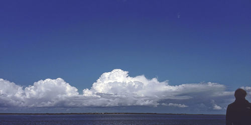 Scenic view of landscape against blue sky