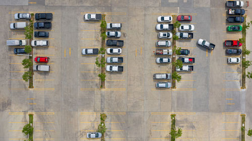 Aerial view of cars parked on street in city