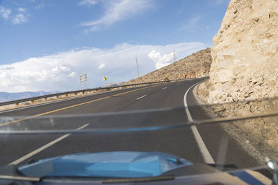 Road seen through car windshield