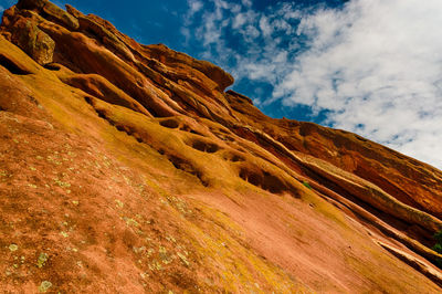 Low angle view of rock formation against sky