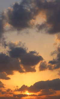 Low angle view of dramatic sky during sunset