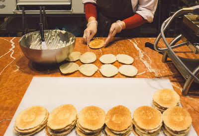 Midsection of person preparing food