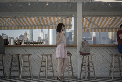 Woman standing in shopping mall