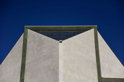 Low angle view of building against blue sky