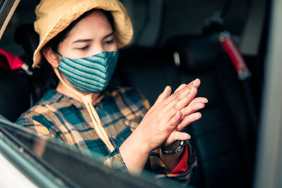 Portrait of woman sitting in car