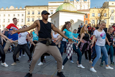 Group of people in front of buildings