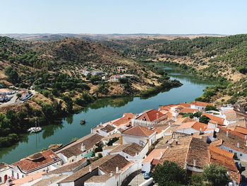 High angle view of river by buildings in city