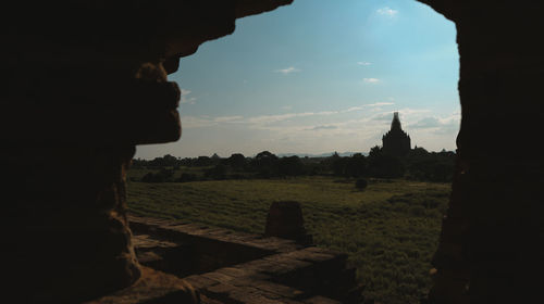 Side view of silhouette man on field against sky