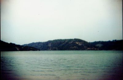 Scenic view of lake against clear sky during winter