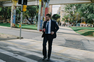 Full length of a man walking in city