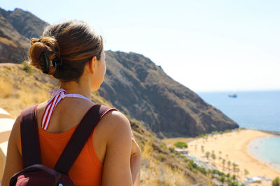 Rear view of woman looking at sea