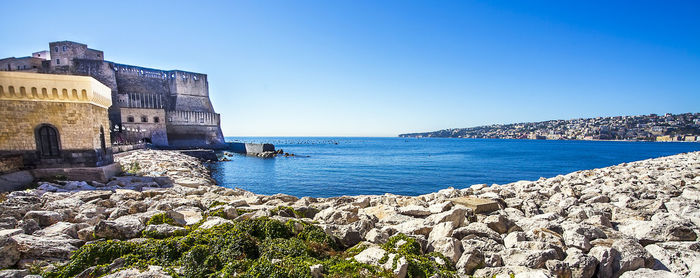 Scenic view of sea against clear blue sky