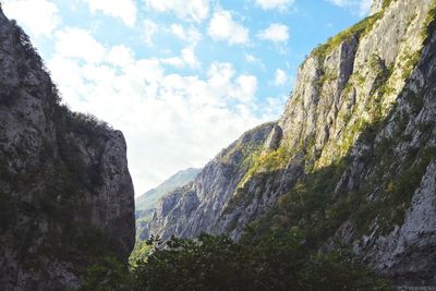 Low angle view of rock formation against sky