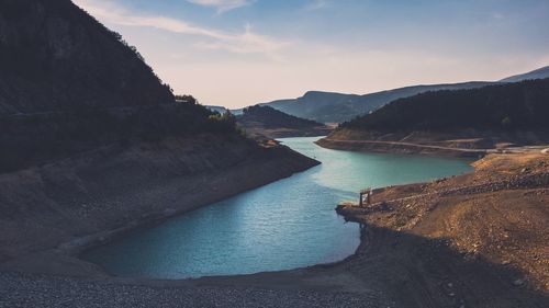 View of river with mountain range in background