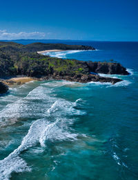 Scenic view of sea against blue sky