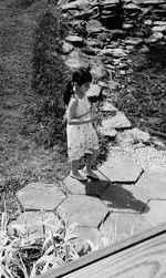 High angle view of woman standing on field