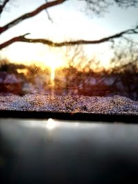 Surface level of frozen water against sky