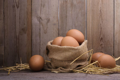 High angle view of eggs in basket on table