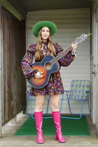 Full length of woman wearing hat