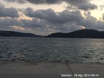 Scenic view of sea against cloudy sky