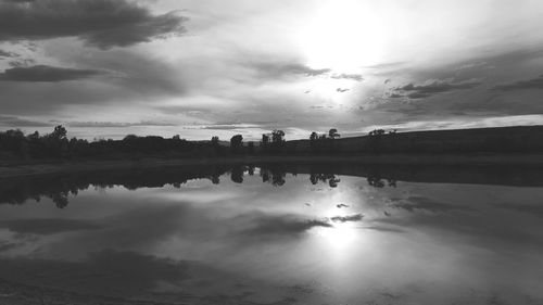 Scenic view of sea against cloudy sky