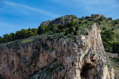Low angle view of rocks against sky