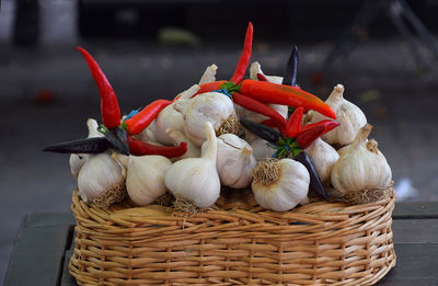 Close-up of garlic and pepper in basket