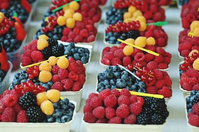 High angle view of fruits in containers on table