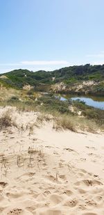 Scenic view of beach against clear sky