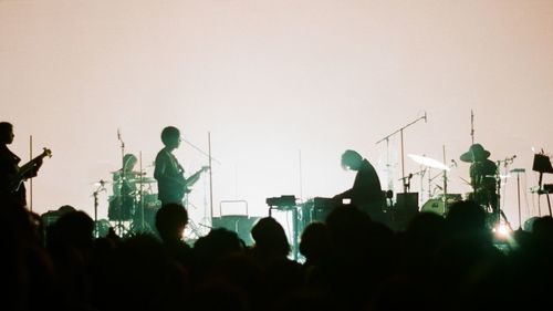 Silhouette people at music concert