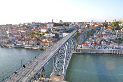 High angle view of dom luis i bridge over river against buildings and sky in city