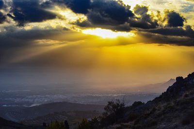 Scenic view of dramatic sky during sunset