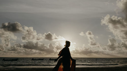 Man looking at sea against sky