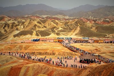 High angle view of people on landscape against mountains