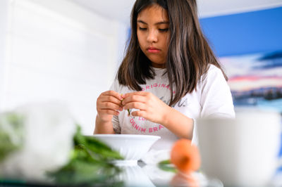 Portrait of young woman using mobile phone