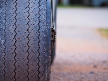 Close-up of tire track on road