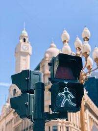 Low angle view of road signal against sky